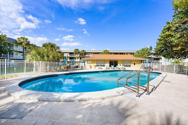 view of swimming pool featuring a patio