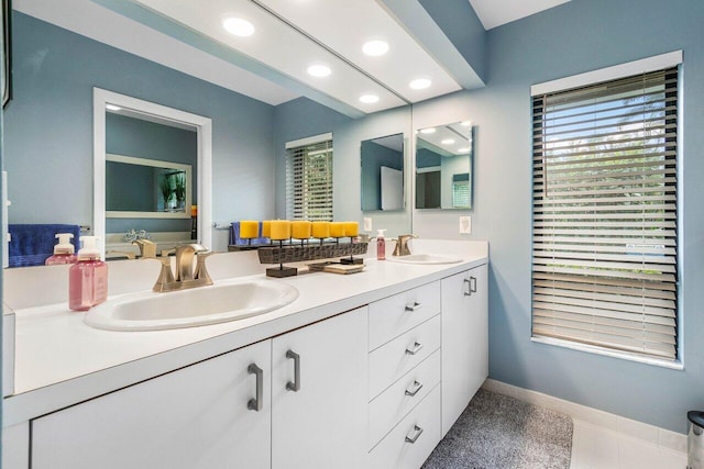 bathroom with vanity and plenty of natural light