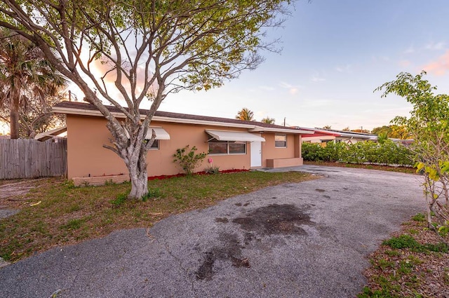 view of front of house with a yard