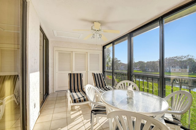 5267 Europa Dr Unit M, Boynton Beach, FL 33437 - sunroom / solarium with a ceiling fan, a water view, tile patterned floors, and plenty of natural light
