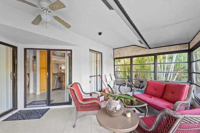 sunroom / solarium featuring ceiling fan