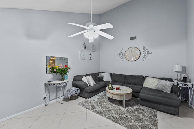 tiled living room featuring high vaulted ceiling and ceiling fan