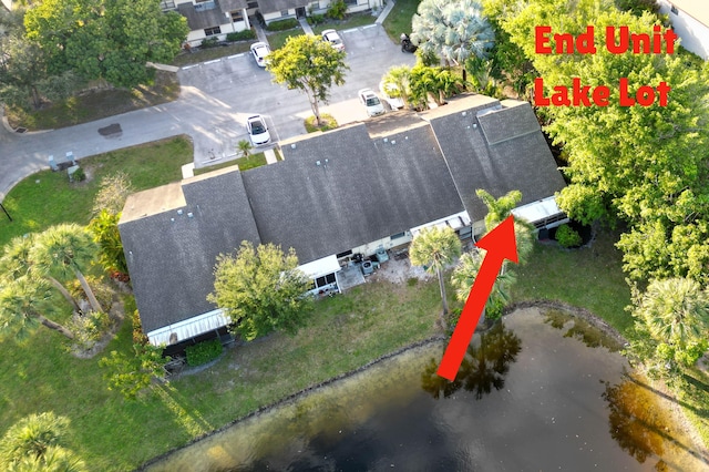 birds eye view of property with a water view