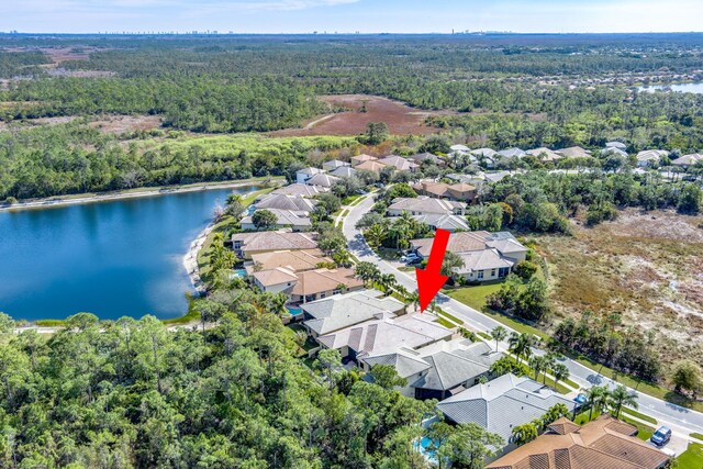 birds eye view of property featuring a water view and a residential view