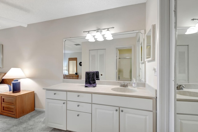 bathroom with vanity and an enclosed shower