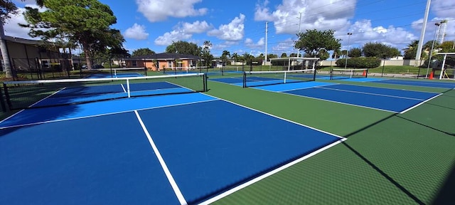 view of sport court with basketball hoop