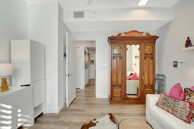 living area with light hardwood / wood-style flooring