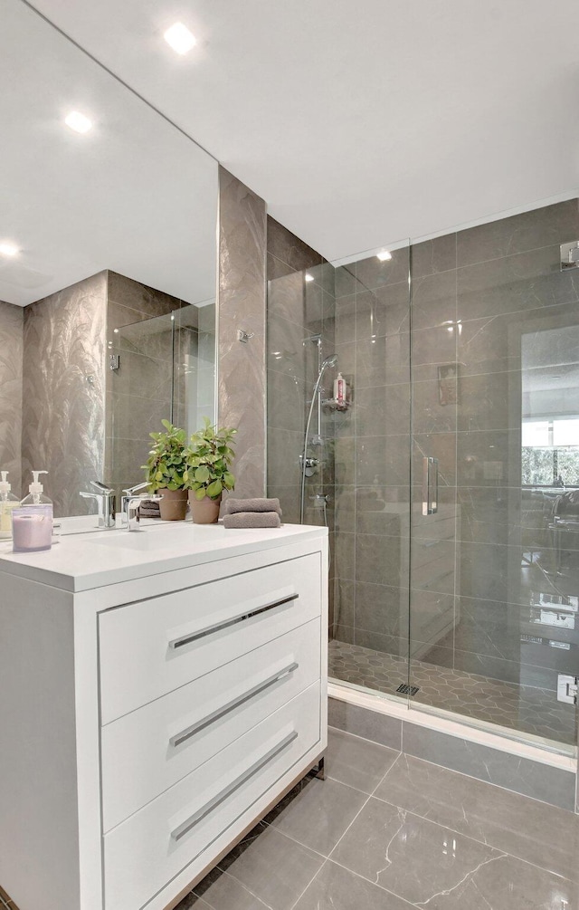 bathroom with vanity and walk in shower