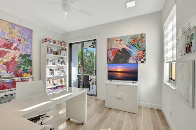 office area with ceiling fan and light hardwood / wood-style flooring