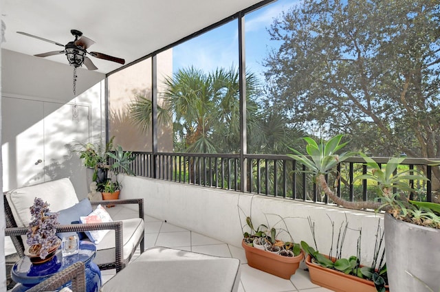 sunroom featuring ceiling fan