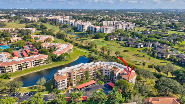 birds eye view of property with a water view