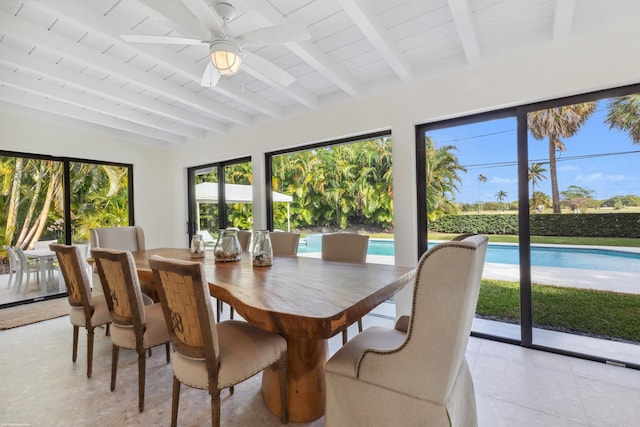 sunroom featuring ceiling fan and beam ceiling