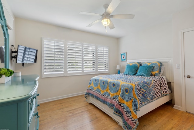 bedroom featuring light hardwood / wood-style flooring and ceiling fan