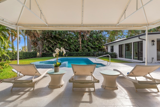 view of pool featuring a patio area