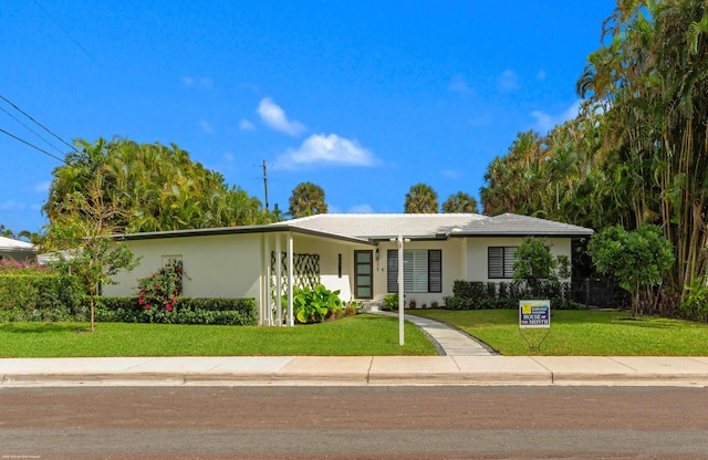 single story home with a carport and a front lawn