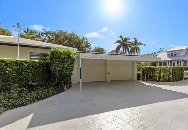 exterior space with a carport