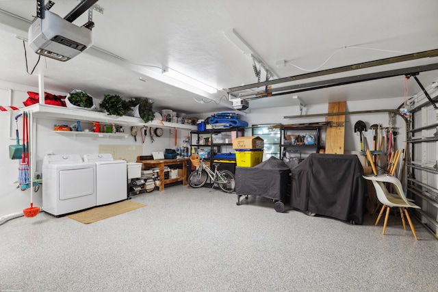 garage featuring a garage door opener and washer and clothes dryer