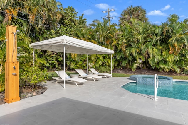 view of swimming pool featuring a patio area