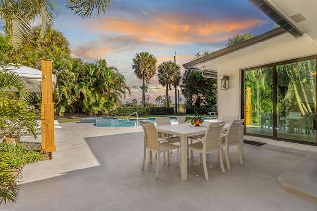 view of patio terrace at dusk