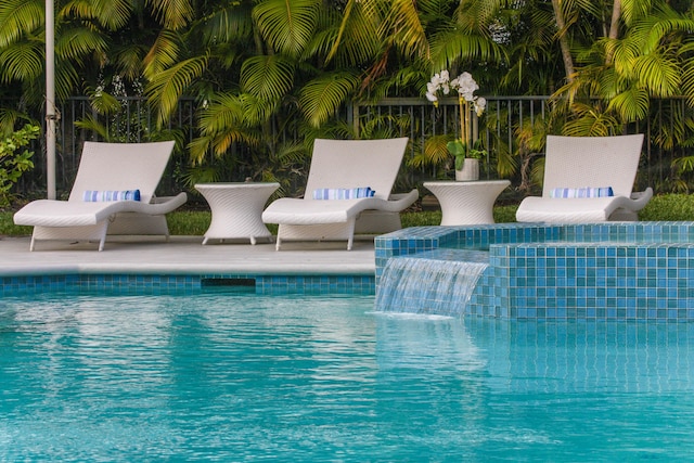 view of swimming pool featuring pool water feature