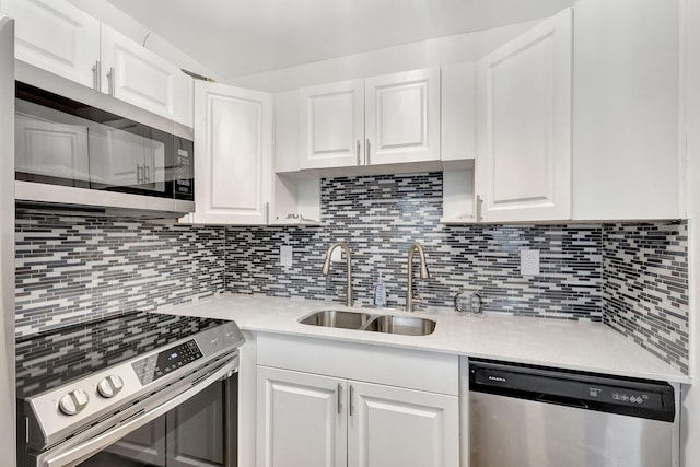 kitchen featuring white cabinetry, sink, and stainless steel appliances