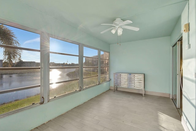 sunroom with a ceiling fan