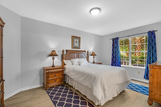 bedroom with hardwood / wood-style floors