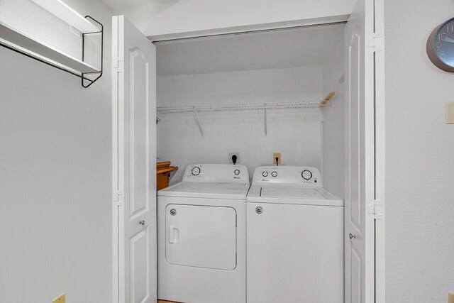 washroom with washer and clothes dryer