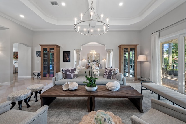 living room featuring a raised ceiling, crown molding, and a notable chandelier