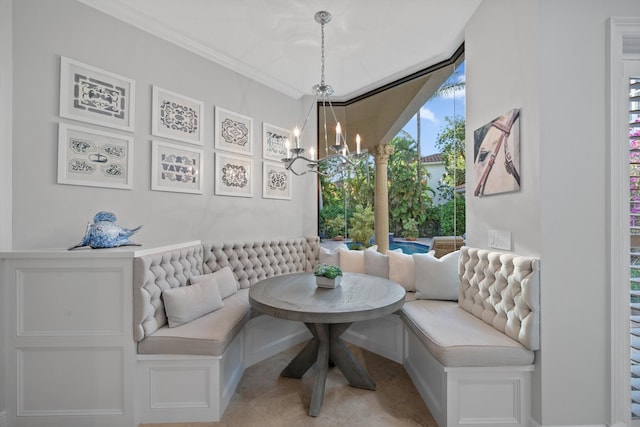 dining space with ornamental molding, light tile patterned flooring, a notable chandelier, and breakfast area