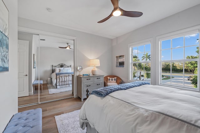 bedroom featuring light hardwood / wood-style flooring and ceiling fan