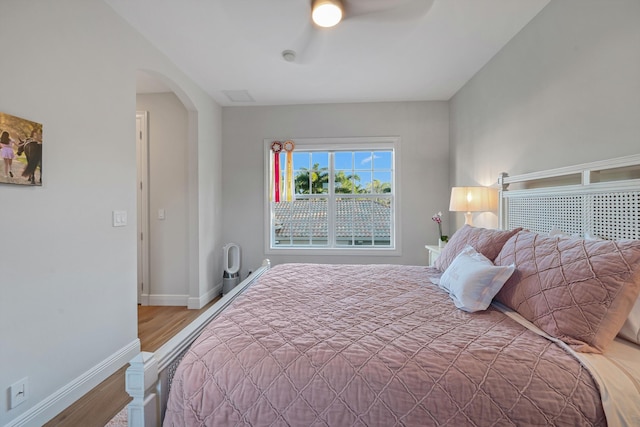 bedroom featuring wood-type flooring and ceiling fan