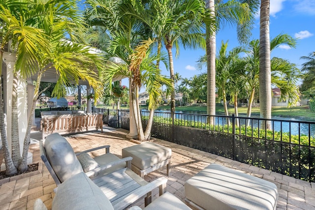 view of patio with a water view