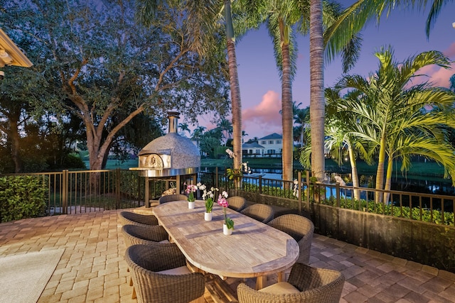 view of patio terrace at dusk