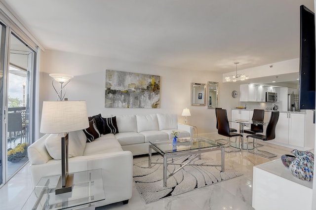 living room with a notable chandelier