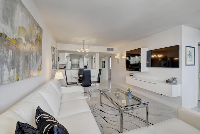 living room with an inviting chandelier