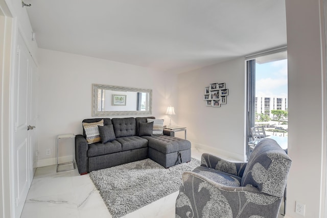 living room featuring expansive windows and a wealth of natural light