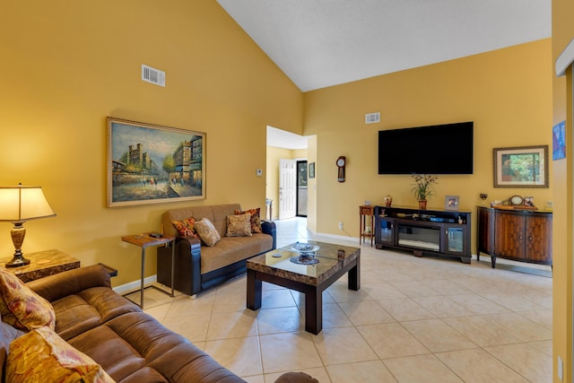 tiled living room featuring high vaulted ceiling