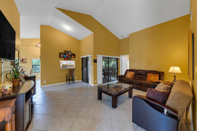 5951 Parkwalk Dr, Boynton Beach, FL 33472 - living area featuring baseboards, high vaulted ceiling, and light tile patterned floors