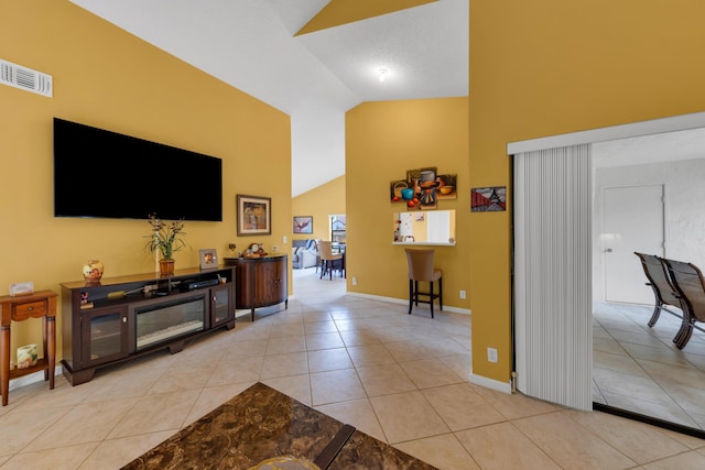5951 Parkwalk Dr, Boynton Beach, FL 33472 - living area with light tile patterned flooring, baseboards, high vaulted ceiling, and visible vents