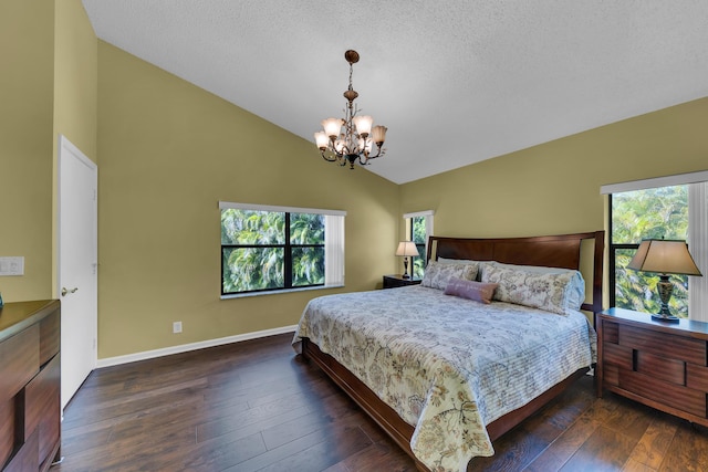 bedroom with dark hardwood / wood-style flooring, vaulted ceiling, a textured ceiling, and a notable chandelier