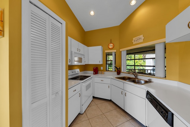 kitchen featuring white cabinetry, sink, white appliances, and light tile patterned flooring