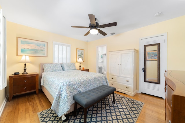 bedroom featuring connected bathroom, ceiling fan, and light hardwood / wood-style flooring