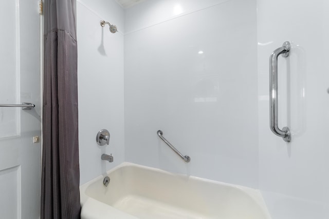 bathroom with shower / bath combo with shower curtain