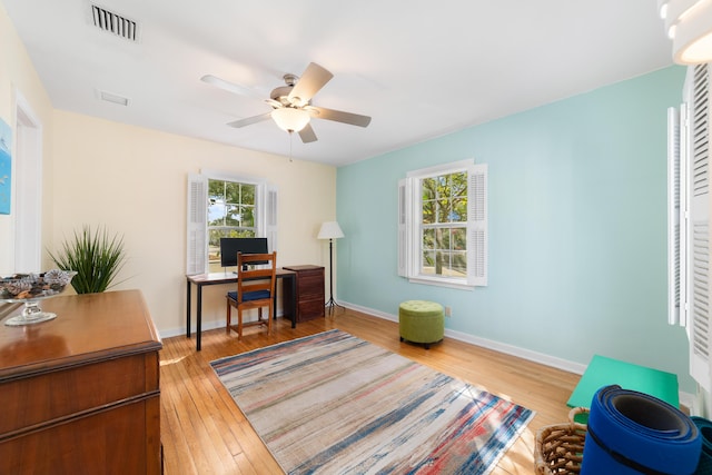 office featuring hardwood / wood-style flooring and ceiling fan