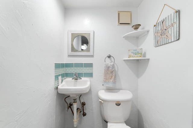 bathroom featuring toilet and sink