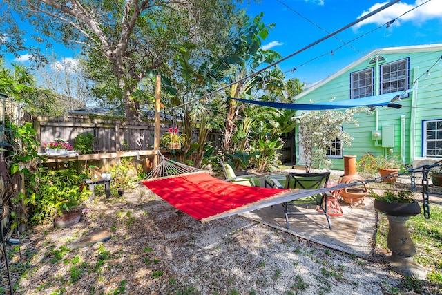 view of yard featuring an outdoor fire pit and a patio