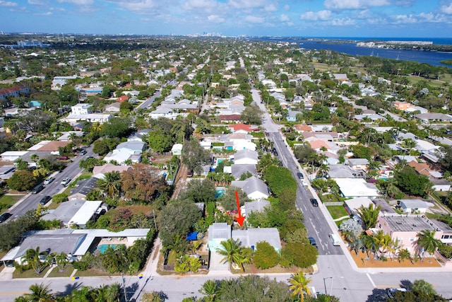 birds eye view of property with a water view