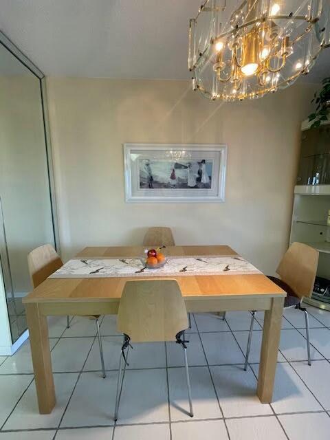 dining room featuring breakfast area and tile patterned floors