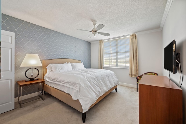 carpeted bedroom featuring ceiling fan, crown molding, and a textured ceiling